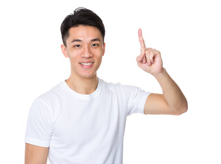 Asian young man with finger point up