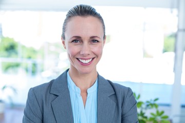 Smiling businesswoman looking at camera