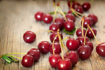 Fototapeta na wymiar Sweet cherries on wooden board