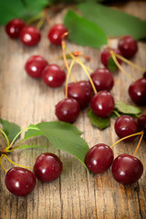 Sweet cherries on wooden board