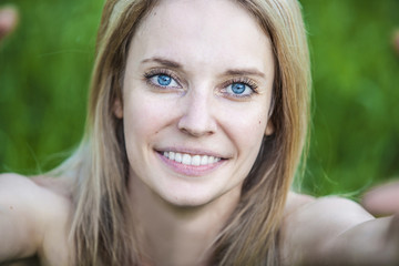 Portrait of a woman doing a self-portrait closeup