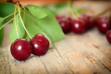 Ripe red cherry berries with leaves