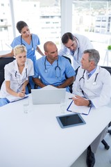 Team of doctors discussing during meeting 