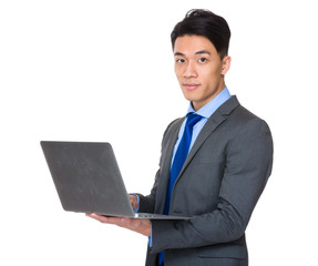 Asian businessman use of notebook computer