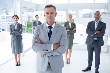 Fototapeta premium Businessman colleagues arm crossed