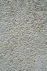 Light green pebbles mosaic on wall closeup