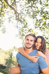 Naklejka premium Cute couple having fun in park