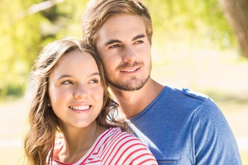 Cute couple hugging in the park