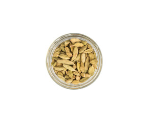 Cardamom spices in a mason jar over white background
