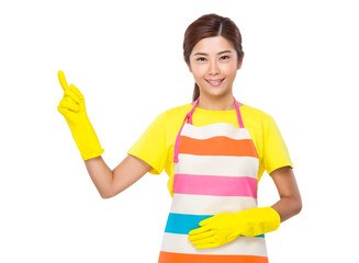 Housewife with plastic gloves and finger point up