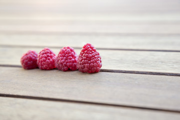raspberries on wooden table