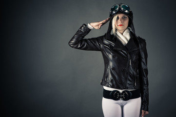 woman with aviator helmet saluting