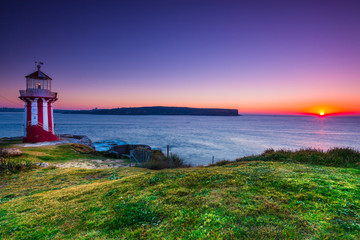 Sunrise seascape and lighthouse at Watson bay, Sydney, Australia.