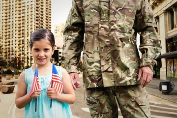 Composite image of soldier reunited with his daughter