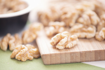 Walnuts on wooden cutting board