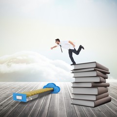 Composite image of geeky young businessman running late