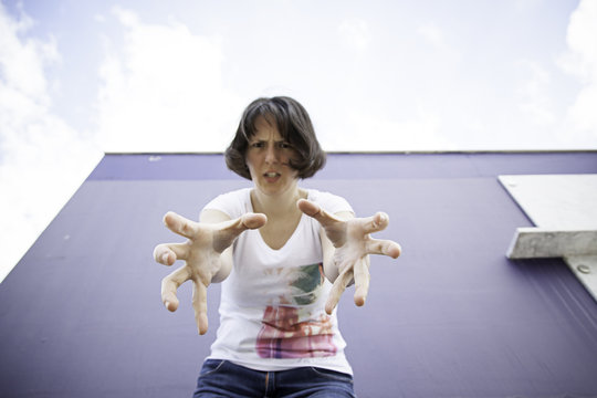 Serious woman attacking