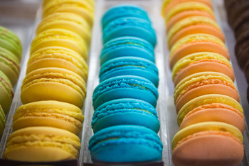 traditional french colorful macarons in a rows