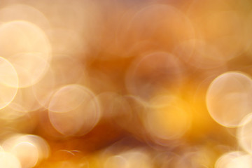 golden orange autumn background blur bokeh, defocusing lens