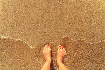 Retro Effect Of Sea Waves And Girl Feet On Summer Sand Beach