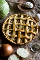 Traditional rustic vegetarian pie with cabbage and onions