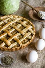 Traditional rustic vegetarian pie with cabbage and onions