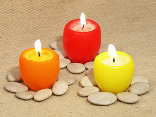 Fototapeta na wymiar Three multicolored candles.