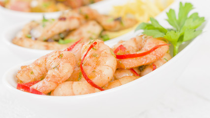 Gambas Pil Pil - Sizzling prawns with chili and garlic. Traditional Spanish tapas dish.
