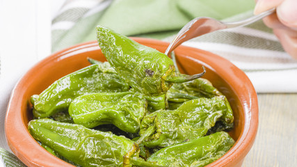 Padron Peppers - Fried Spanish green peppers with olive oil and sea salt. Traditional Spanish tapas.
