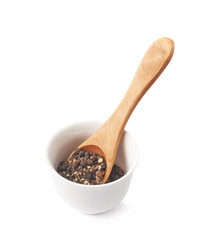 Cup filled with black peppercorn