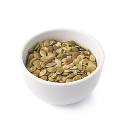 White cup filled with pumpkin seeds