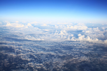 Fototapeta premium view from the bird's-eye view of the airplane window at the horizon and clouds