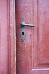old wooden entrance door with antique door handle