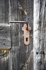 old wooden entrance door with antique door handle