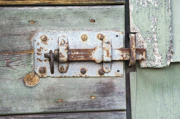 closeup of an old rustic wooden barn door