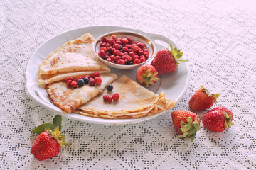 Plate with pancakes and  strawberries