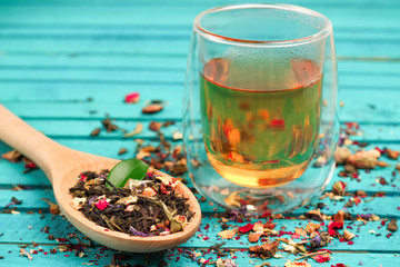 Tea in a spoon and a glass