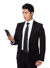 Businessman read on mobile phone