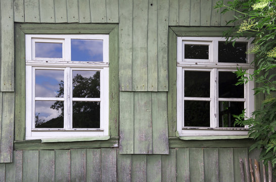 two windows of an old wooden house