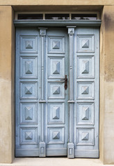 old wooden entrance door with antique door handle