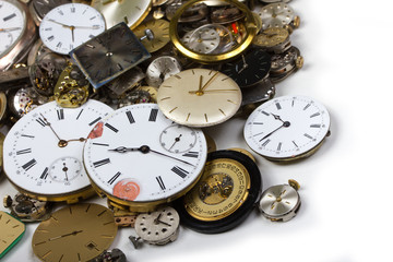 a bunch of pocket watch clockworks