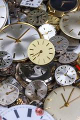 a bunch of pocket watch clockworks