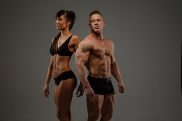 Fototapeta na wymiar Couple of fitness woman and man bodybuilder
