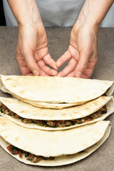 Chef making quesadillas.