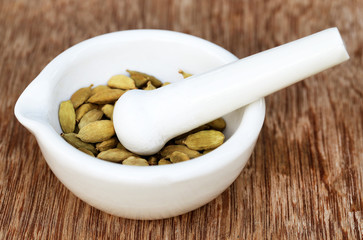 Cardamom seeds in a mortar