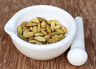 Cardamom seeds in a mortar