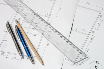 Measurement of house - ruler and pencils on architectural drawin