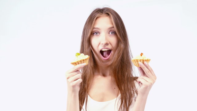 Cheerful girl eating cake