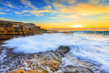 Colorful sunrise seascape at Maroubra rock pool, Sydney, Australia.