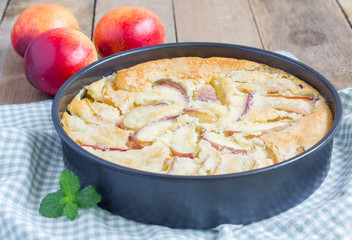 Peach clafoutis in a baking dish